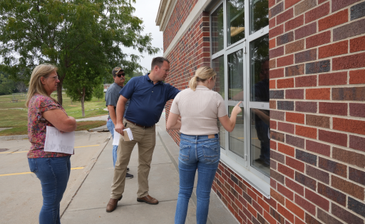 An ariel image of a fire station with two red firetrucks