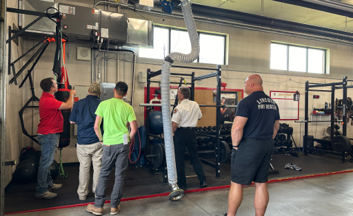An ariel image of a fire station with two red firetrucks